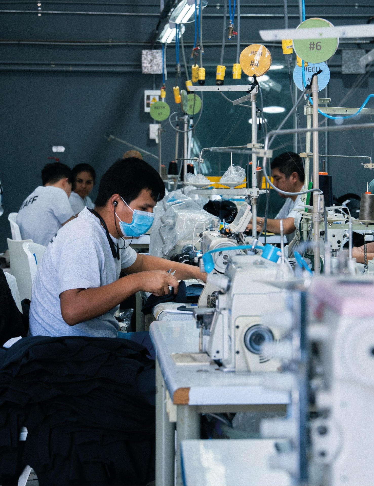 Prospera machinist assembling a garment on the production floor